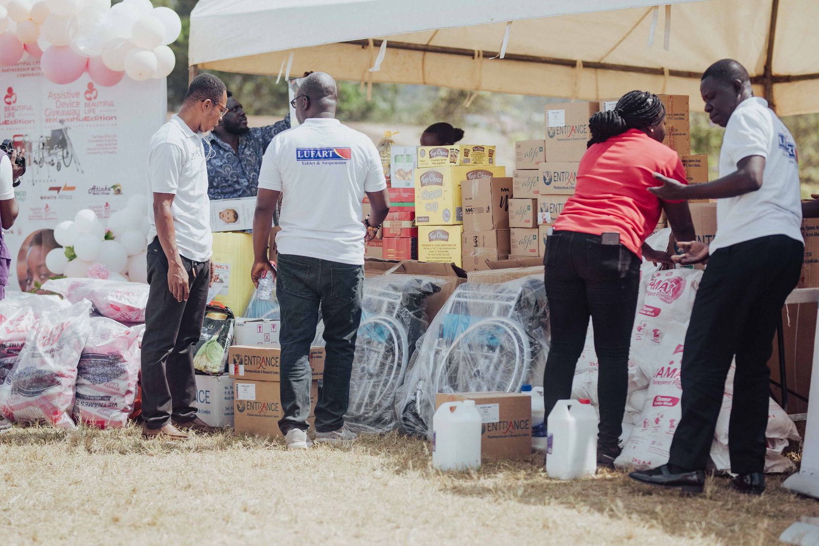Volunteers packing nutritional supply boxes for families